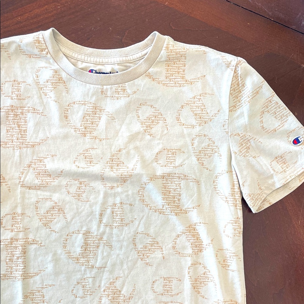 Champion Kids' Tan Logo Graphic Short Sleeve Tee. Knit collar trim. Logo patch